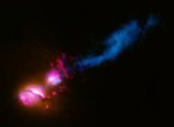 A black hole jet at the center of a galaxy strikes the edge of another galaxy. Image Credit: X-ray: NASA/CXC/ CfA/D.Evans et al.; Optical/UV: NASA/ STScI; Radio: NSF/VLA/CfA/D.Evans et al., STFC/JBO/MERLIN