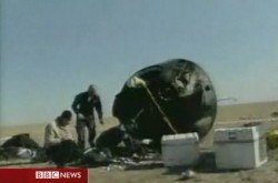 The blackened Soyuz descent capsule after re-entry (BBC)