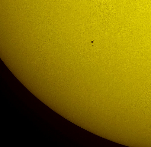 In this tightly cropped image the NASA space shuttle Atlantis and the Hubble Space Telescope are seen in silhouette, side by side during solar transit at 12:17p.m. EDT, Wednesday, May 13, 2009, from west of Vero Beach, Florida. The two spaceships were at an altitude of 600 km and they zipped across the sun in only 0.8 seconds. Photo Credit: (NASA/Thierry Legault) 