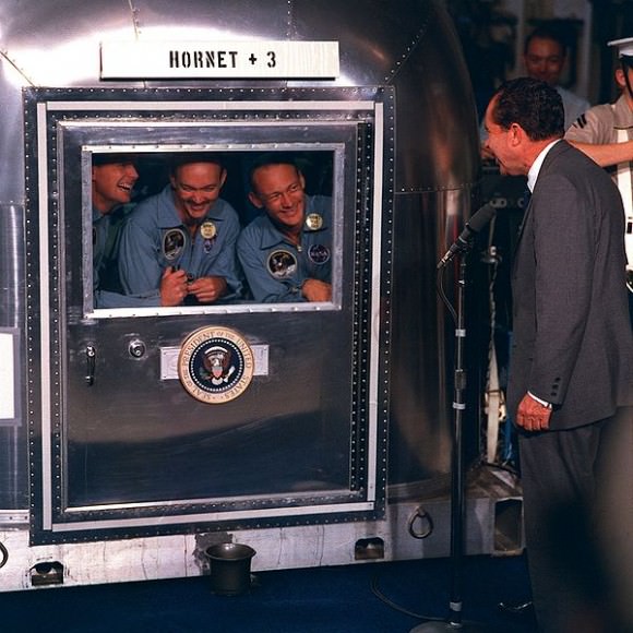 Apollo 11 crew in quarantine talking with President Richard Nixon. Credit: NASA