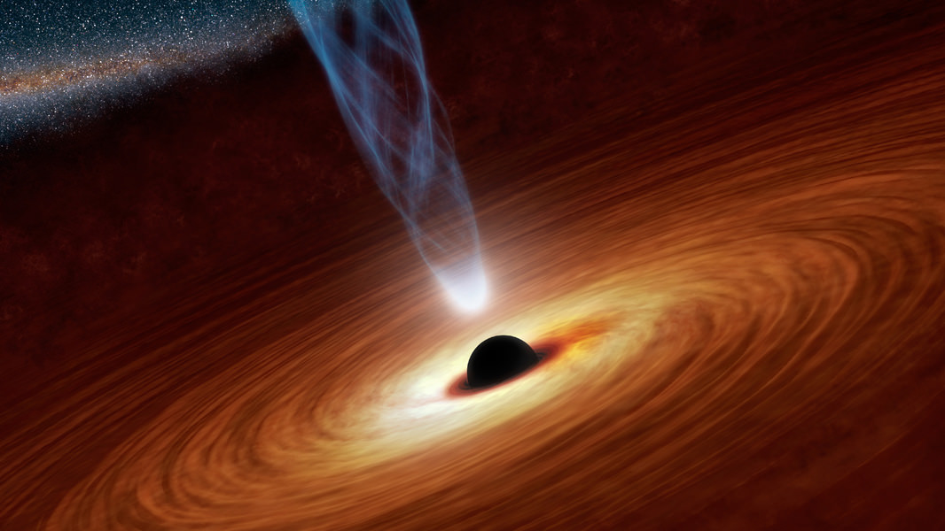 A supermassive black hole has been found in an unusual spot: an isolated region of space where only small, dim galaxies reside. Image credit: NASA/JPL-Caltech