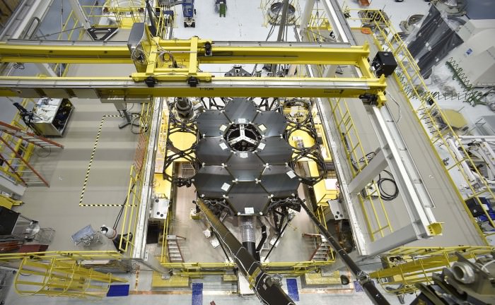 This overhead shot of the James Webb Space Telescope shows part of the installation of the 18 primary flight mirrors onto the telescope structure in a clean room at NASA’s Goddard Space Flight Center in Greenbelt, Maryland. Credits: NASA’s Goddard Space Flight Center/Chris Gunn See time-lapse video below