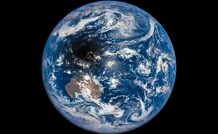 The Moon's shadow is cast across Indonesia in this view from the DSCOVR spacecraft, March 9, 2016. (Courtesy of the DSCOVR EPIC team.)