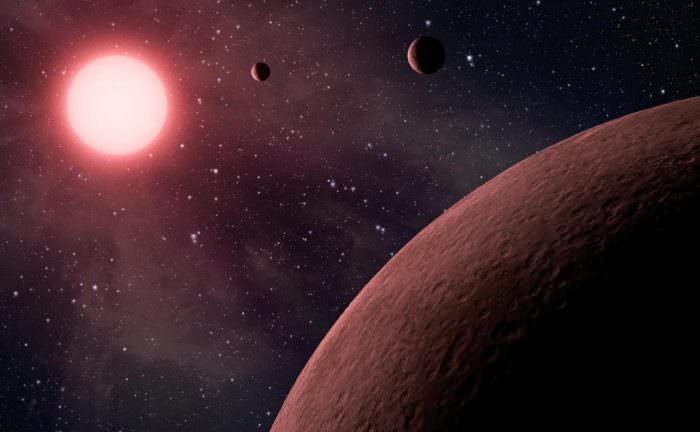 Artist's impression of a system of exoplanets orbiting a low mass, red dwarf star. Credit: NASA/JPL