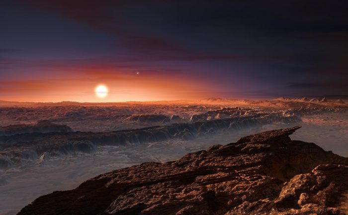 Artist’s impression of the surface of the planet Proxima b orbiting the red dwarf star Proxima Centauri. The double star Alpha Centauri AB is visible to the upper right of Proxima itself. Credit: ESO
