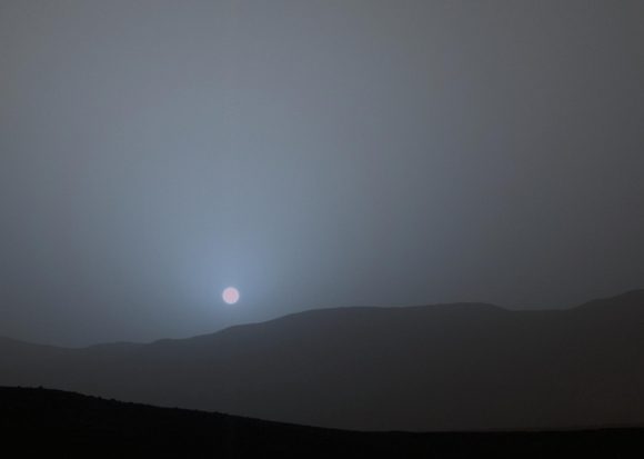 he Curiosity rover recorded this view of the Sun setting at the close of the mission's 956th sol (April 15, 2015), from the rover's location in Gale Crater. This was the first sunset observed in color by Curiosity. The image comes from the left-eye camera of the rover's Mast Camera (Mastcam). Credit: NASA/JPL-Caltech/MSSS/Texas A&M University.
