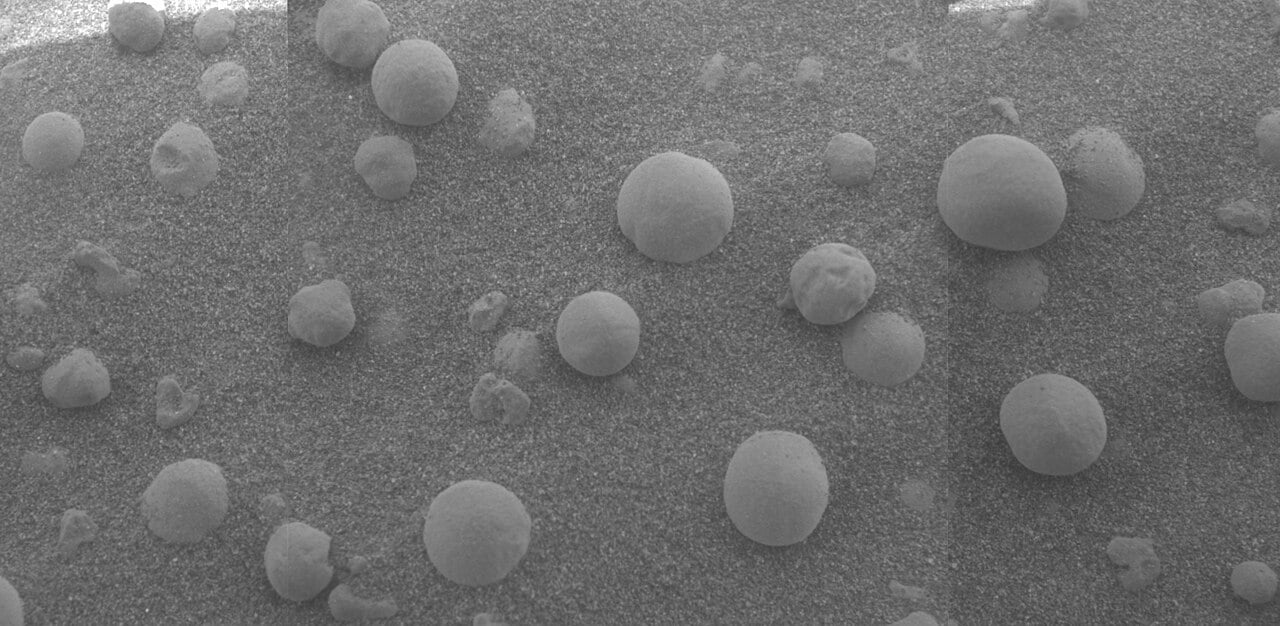 Martian "blueberries" as seen by the Opportunity Rover at Meridiani Planum during its exploration. These hematite orbs likely formed in contact with water. Credit: NASA/JPL Public Domain.