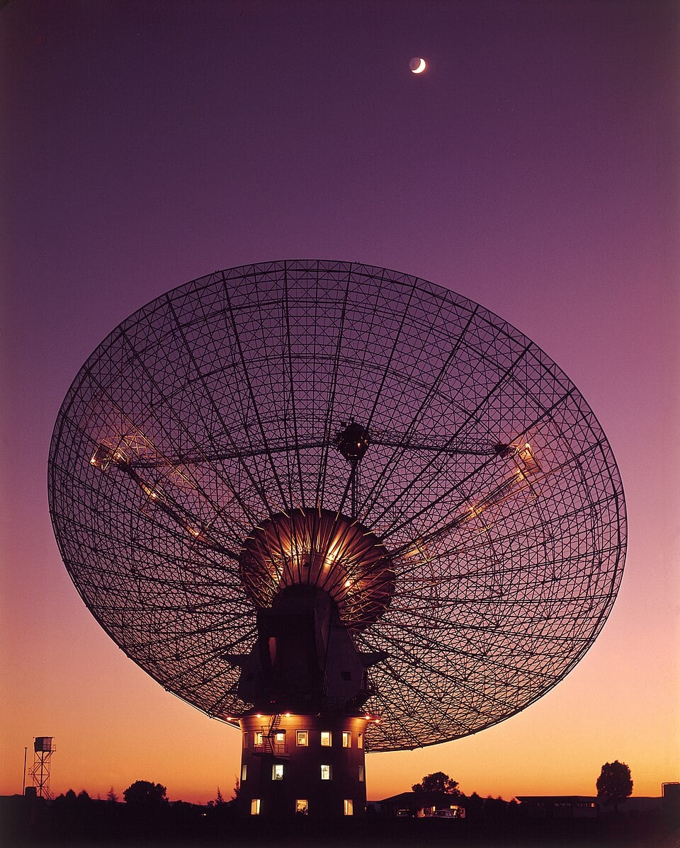 The 64-meter radio telescope at Parkes Observatory as seen in 1969, when it was used to receive live televised video from Apollo 11, Credit: CSIRO via Wikipedia