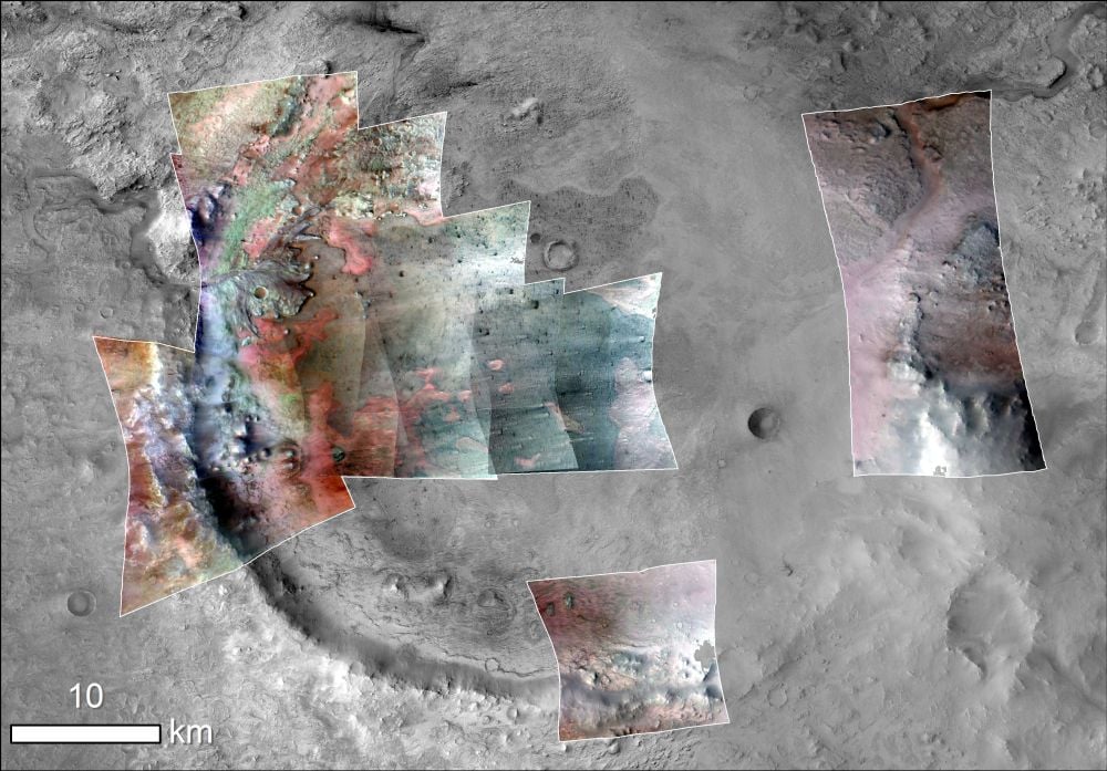 A composite image of the Jezero Crater from the MRO's CRISM instrument and its Context Camera. Colors have been added to show minerals. Green represents carbonates, that minerals that preserve fossils so well here on Earth. The red is olivine sand eroding out of carbonate-containing rocks. Image Credit: NASA/JPL-Caltech/MSSS/JHU-APL/Purdue/USGS