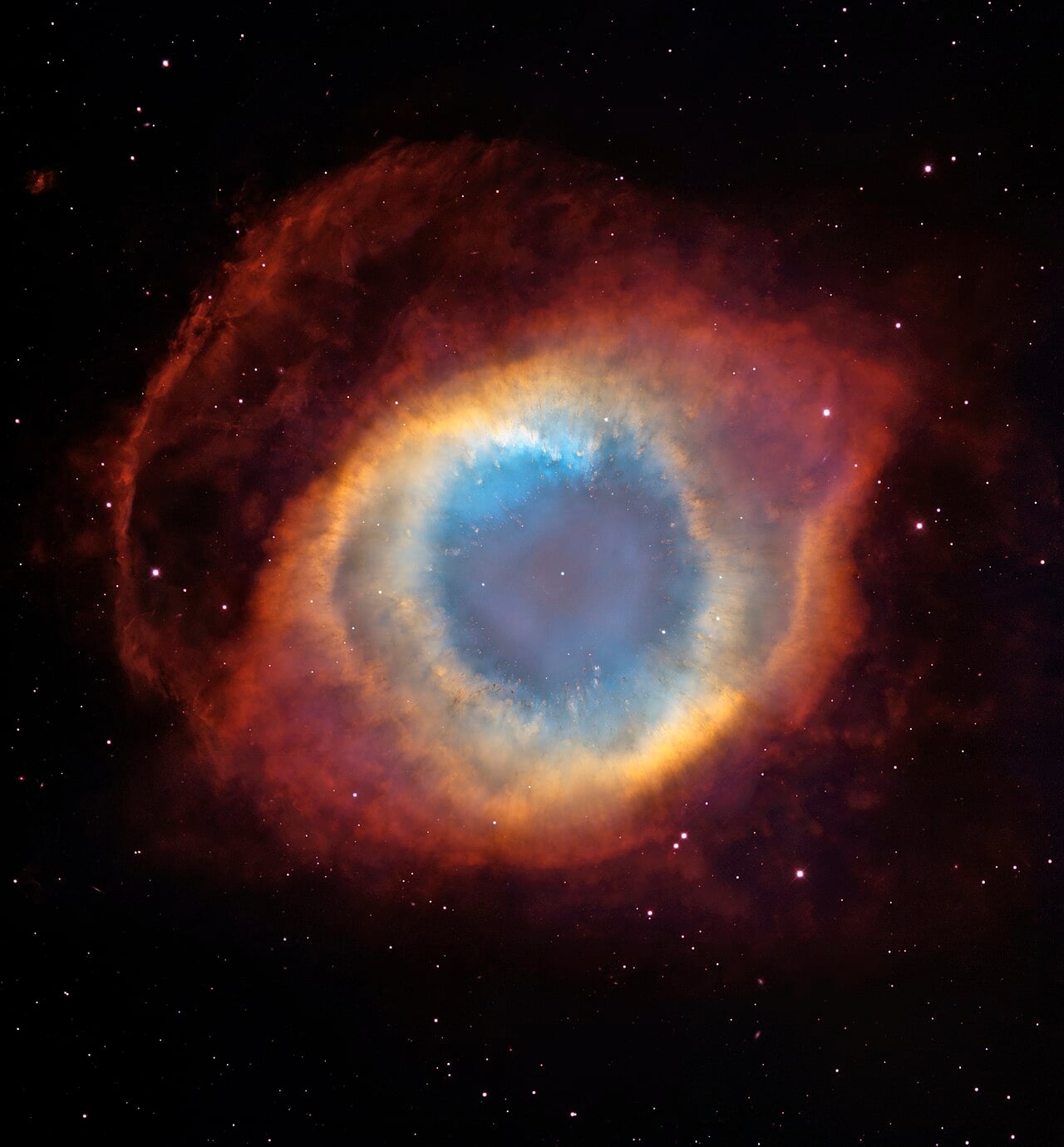 The Helix Nebula, the glowing shell thrown off by a dying star, with a hot white dwarf at its heart. White dwarfs, and the 1.4 solar mass limit that governs them, were Chandrasekhar's breakthrough. Credit: NASA/JPL-Caltech / Wikimedia Commons (public domain).