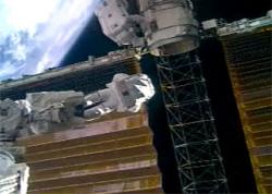 Astronauts working on the solar array. Image credit: NASA TV