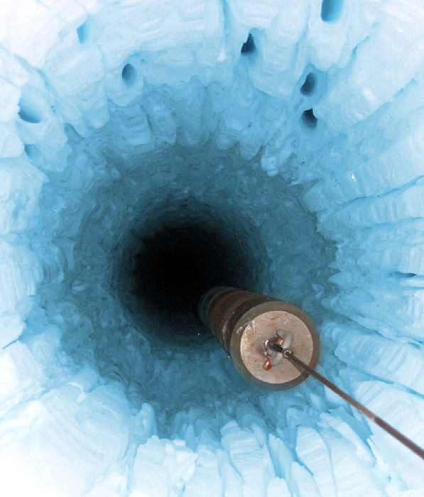 One of the strings of detectors is being lowered into its hole at the IceCube Neutrino Observatory in Antarctica. Image Credit: WISC/IceCube Collaboration.