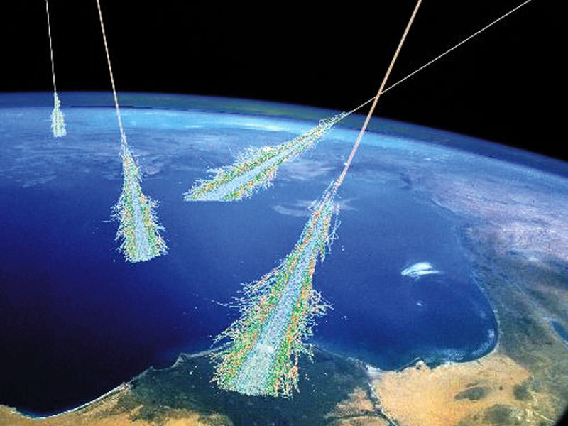 Showers of high-energy particles occur when energetic cosmic rays strike the top of the Earth's atmosphere. Illustration Credit: Simon Swordy (U. Chicago), NASA.