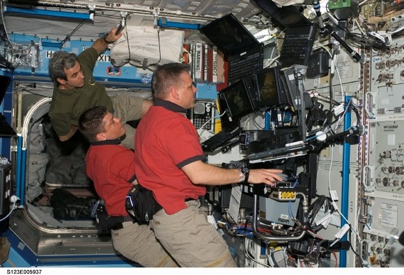 Working with the ISS arm.  Image Credit:  NASA
