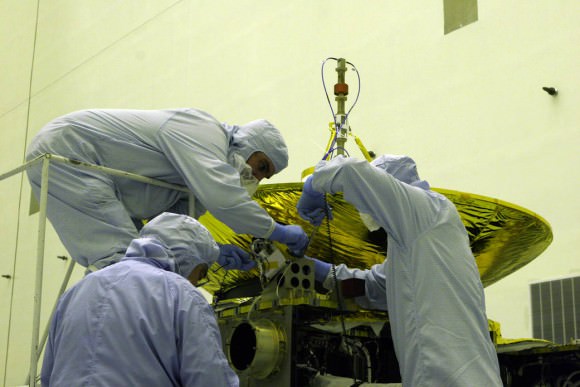 Engineers working on the New Horizons spacecraft's Pluto Energetic Particle Spectrometer Science Investigation (PEPSSI) instrument. Credit: NASA