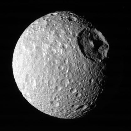 Saturn's moon Mimas is covered in craters, including the dramatic Herschel crater that gives the moon its "Death Star" nickname. But it's close to Saturn. What's going on? Image credit: NASA/JPL/SSI