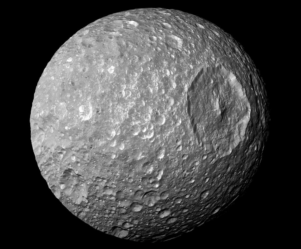 A view of Mimas from the Cassini spacecraft. The moon shows evidence of ancient impacts. Mimas is sometimes called the "Death Star Moon" because of its resemblance to the Death Star in Star Wars. Image Credit:  NASA/JPL/Space Science Institute