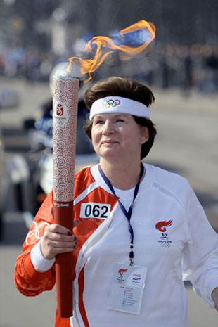 Valentina Tereshkova carrying Olympic torch.  Credit:  Xinhua via CollectSpace
