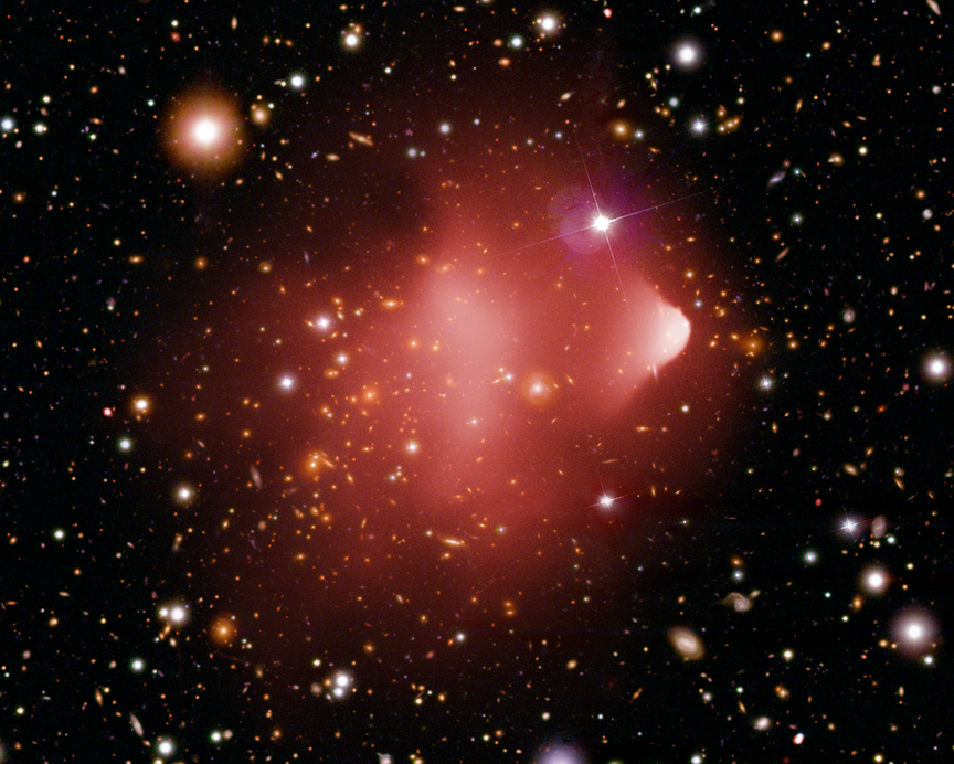 The Bullet Cluster is another of several gigantic galaxy clusters challenging the Lambda-cold dark matter theory of struc ture formation in the early Universe. Credit: X-ray: NASA/CXC/CfA/M.Markevitch et al.; Optical: NASA/STScI; Magellan/U.Arizona/D.Clowe et al. 