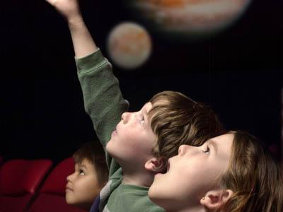 Children enjoy the stars and planets at the Morehead Planetarium in Chapel Hill, North Carolina. 