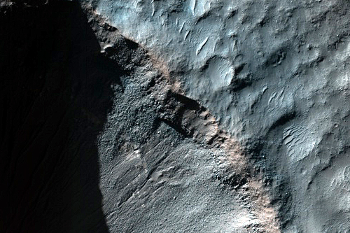 Gullies and Light-Toned Outcrops in Crater Wall  Credit: NASA/JPL/University of Arizona  