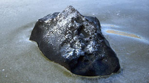 Fragments of a meteorite were found in a small pond at Buzzard Coulee, Sask. on Friday. (Geoff Howe/CP)