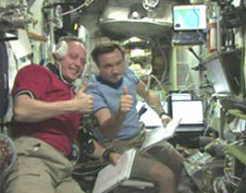 ISS Commander Mike Fincke and Yuri Lonchakov give thumbs up after a successful manual docking of the Progress vehicle. Credit: NASA TV
