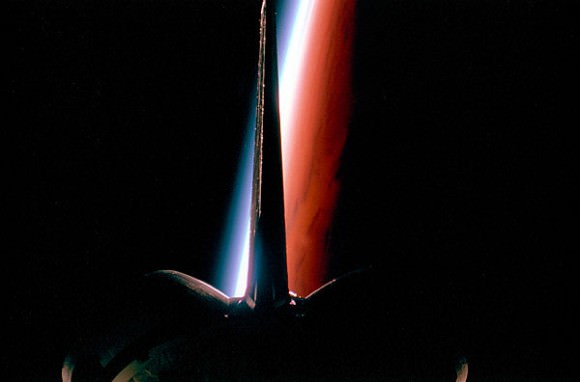 Space Shuttle's tail and Earth's limb.  Credit: NASA