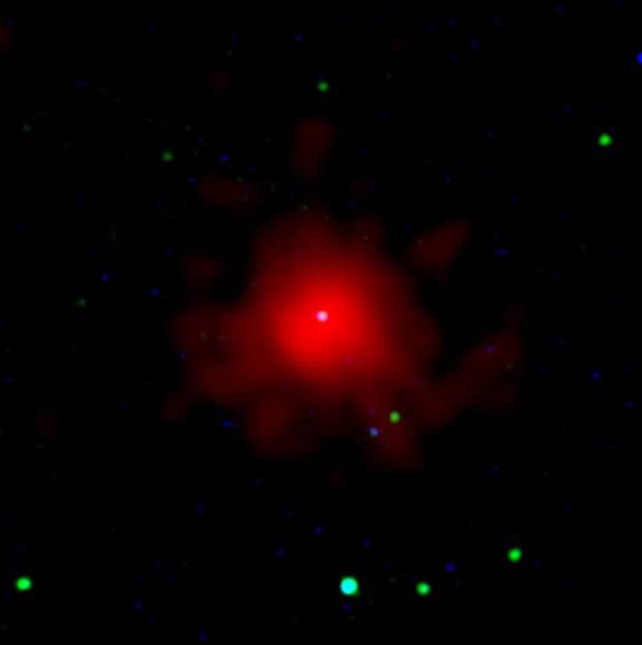 This image merges Swift optical (blue, green) and X-ray views of GRB 080607. The white spot at center is the burst’s optical afterglow. Credit: NASA/Swift/Stefan Immler