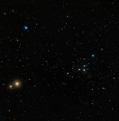 A wide-field image of the region around the Coma galaxy cluster (Abell 1656) constructed from the images in the Digitized Sky Survey. NGC 4921 is the largest galaxy to the left, and slightly below, the pair of galaxies at the centre of the image. The field-of-view is approximately 2.7 x 2.85 degrees.   Credits: NASA, ESA, and the Digitized Sky Survey 2. Acknowledgment: Davide De Martin (ESA/Hubble)