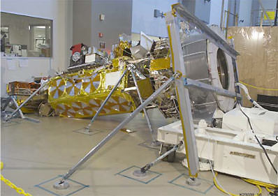The NOAA N-Prime satellite on the floor of the factory of where it was being assembled.  Credit: NASA