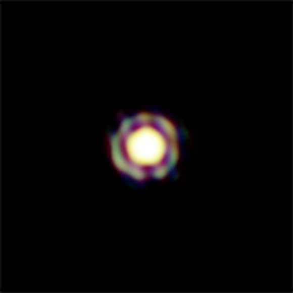 This image from ESO’s Very Large Telescope Interferometer is one of the sharpest colour images ever made. It shows the Mira-like star T Leporis in great detail. The central disc is the surface of the star, which is surrounded by a spherical shell of molecular material expelled from the star. In order to appreciate the feat of such measurement, one should realize that the star appears, on the sky, as small as a two-storey house on the Moon. The resolution of the image is about 4 milli-arcseconds.