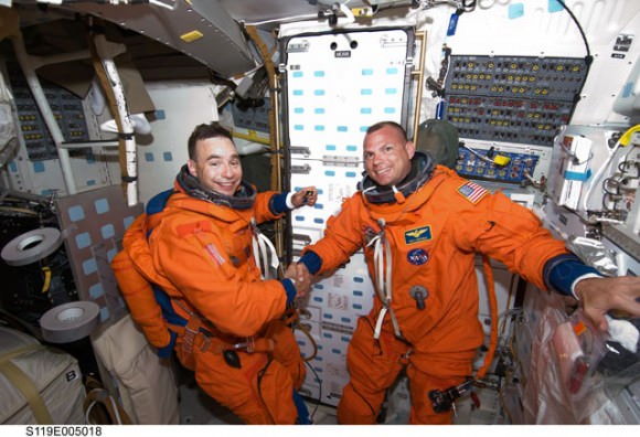 Lee Archambault and Tony Antonelli shake hands after a successful launch.  Credit: NASA