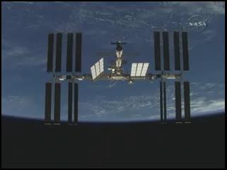 Screenshot of ISS flyaround by shuttle Discovery.  Credit: NASA TV