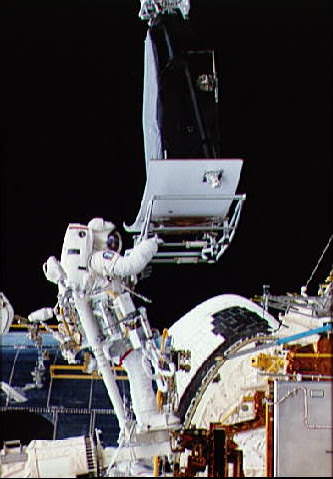 Hoffman installing WFPC2 on Hubble.  Credit: NASA