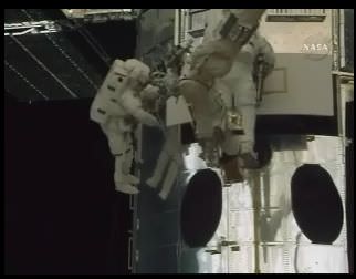 Astronauts removing WFPC2 from Hubble. Credit: NASA TV