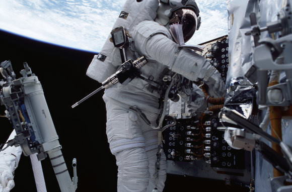 The pistol grip tool has been a standard instrument for spacewalkers for missions to the Hubble Space Telescope and construction of the International Space Station. Here, the tool, which resembles a cordless drill, is slung on an astronaut's spacesuit as he works on the telescope. Credit: NASA