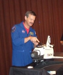 Scott Altman cuts a space shuttle cake at the Lakeview Museum in Peoria, IL.  Photo: N. Atkinson