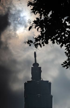 Solar eclipse occurring over Taipei of southeast China's Taiwan
