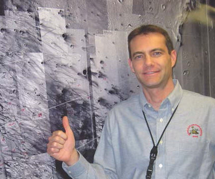 Chris Potts points to Gusev Crater on Mars on January 4, 2004, after the MER navigation team landed the Spirit rover on Mars with unprecedented accuracy. Photo courtesy of Chris Potts