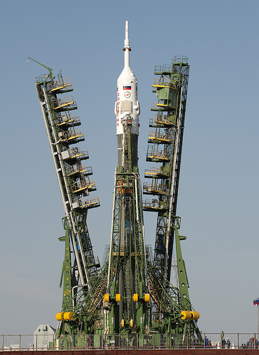 Launch scaffolding is raised into place around the Soyuz rocket.  Photo Credit: (NASA/Bill Ingalls)