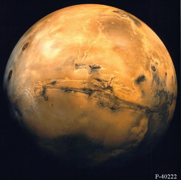 Mars from orbit.  Valles Marineris and Volcanic region