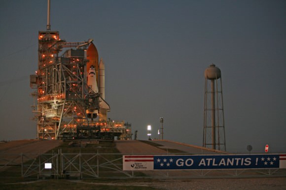 The protective Rotating Service Structure is about halfway through its 25 minute long rollback at dusk on 15 November 2009 to expose Atlantis for launch at Kennedy Space Center Pad 39 A.  Credit: Ken Kremer  