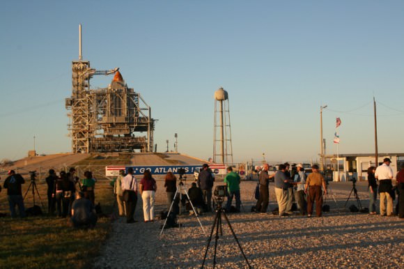 Media from around the globe have descended on the Kennedy Space Center press site to report on STS 129.  I met journalists from many countries including India, Australia, Japan, Korea, Slovenia, Poland, Netherlands, Germany, Turkey, United States and more. RSS rollback has just commenced as we stand at the perimeter security fence surrounding Pad 39 A. Credit: Ken Kremer     