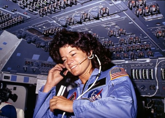 Sally Ride communicates with ground controllers from the flight deck during the six-day mission in Challenger, 1983. Credit: U.S. National Archives and Records Administration