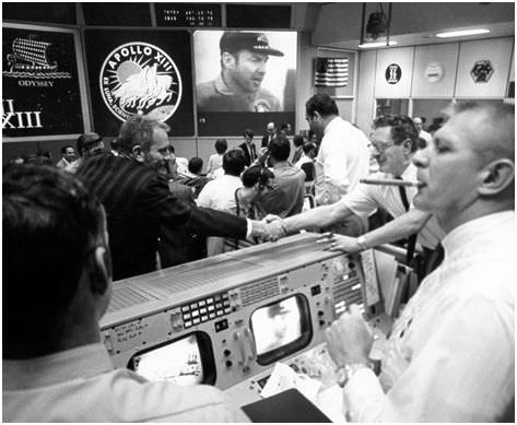 The view in Mission Control after Apollo 13 landed safely.  Gene Kranz is featured on the right. Credit: NASA
