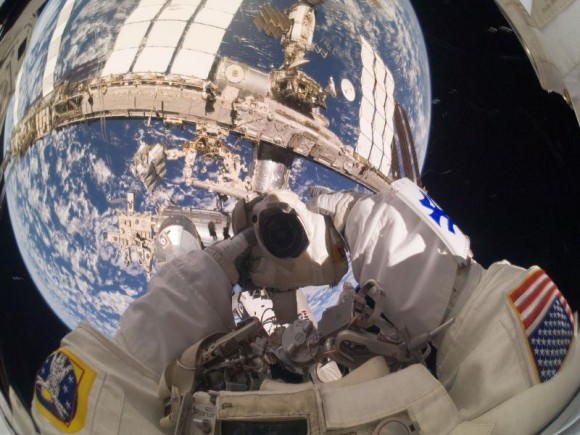 NASA astronaut Garrett Reisman takes a self-portrait visor while participating in the first of three spacewalks. Credit: NASA