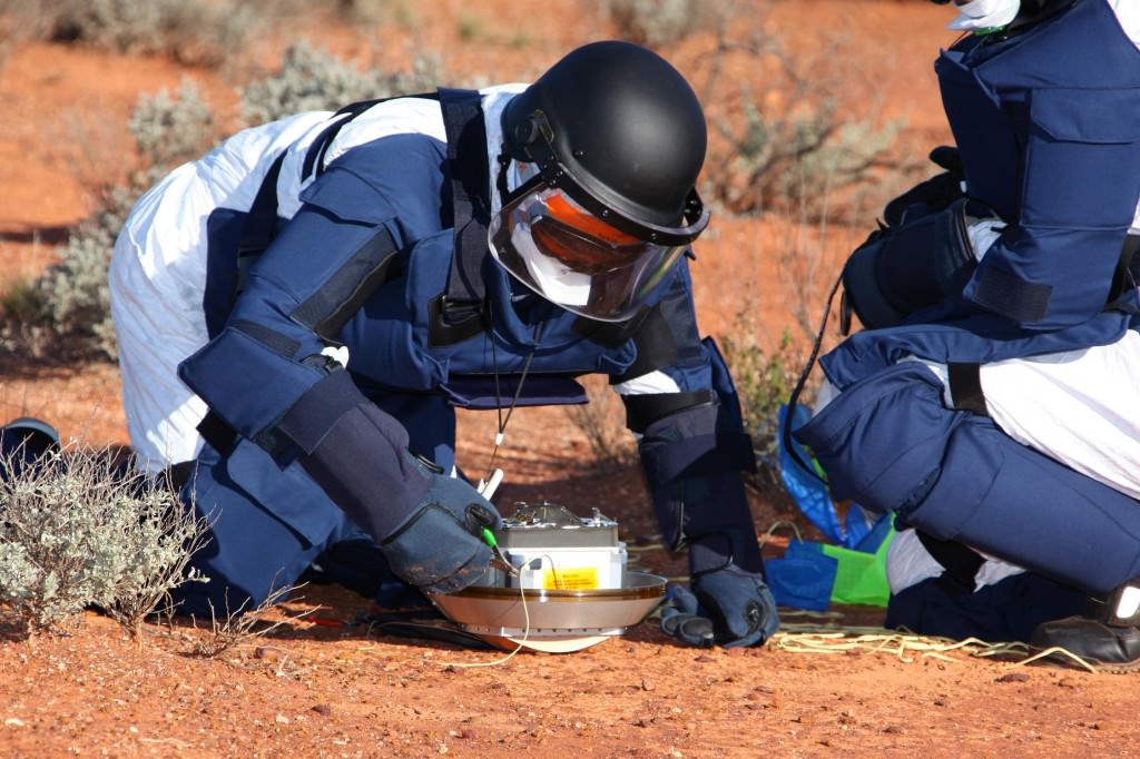 Recovery team makes sure all is safe with the sample return canister from the Hayabusa 1 Mission. 
