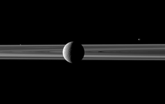 Rhea poses with Saturn's rings; Janus and Prometheus are off in the distance.  Credit: NASA/JPL/Space Science Institute. Click for larger version