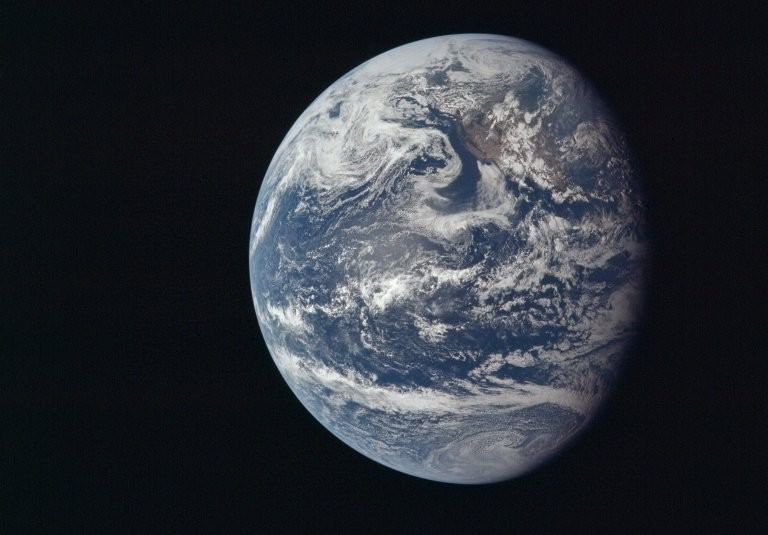Earth as viewed from the cabin of the Apollo 11 spacecraft. Earth was once a magma ocean, a hellish place hostile to life. Now it's a beautiful, benign ocean world covered in life. Credit: NASA